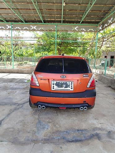 dizel generator qiymetleri: Kia Rio hatchback (CRDI, Sport paket yazıları ilə). Narıncı-qara iki — 2