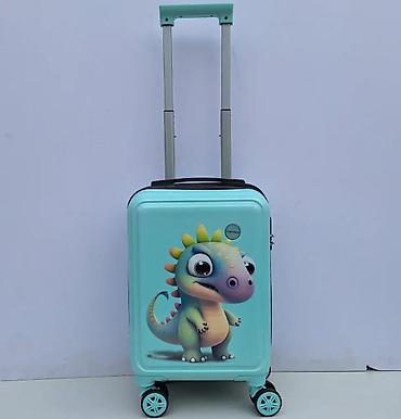 suknje ps: Dečiji kofer tirkizne boje sa motivom dinosaurusa. Kofer poseduje — 1