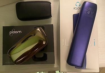 iqos iluma prime i: IQOS ILUMA i və Ploom cihaz dəsti birlikde adaptorlari ustunde — 2