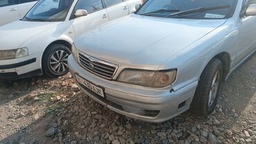 нисан сефро ошто: Серебристый седан Nissan Cefiro с логотипом Nissan на решетке