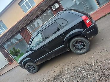 l200 disk: Hyundai Tucson, qara rəng, şəhər və uzun yol üçün rahat SUV. Texniki — 5