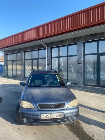 Opel: Model: Opel Astra Caravan (universal kuzov) Rəng: tünd boz Yanacaq — 8