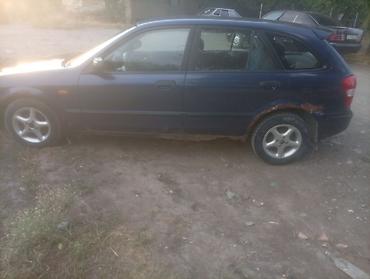 губа 211: Mazda 323: 2000 г., Механика, Бензин — 8