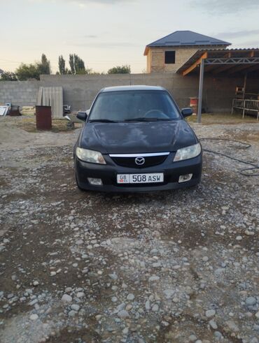 демио багажник: Mazda 323 F Wagon (универсал), черный цвет. Кузов: - Универсал 5