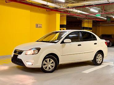 avtomobil az zil 130: Kia Rio: 1.4 л | 2010 г. Седан — 3