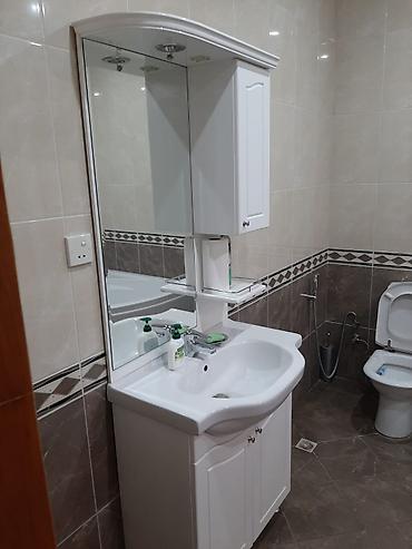 ev t: T. Əliyev küçəsində. Mülkiyyətdə 650m² olan. 7 sotda 4mərtəbəli 8 — 10