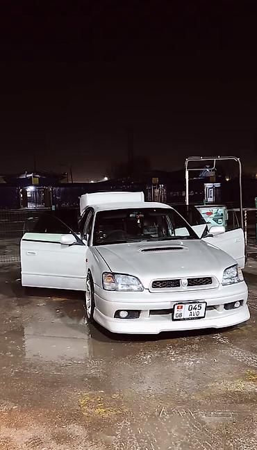 громкий выхлоп: Subaru Legacy: 1999 г., 2 л, Автомат — 9
