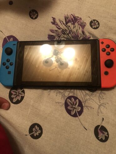 komputer cantalari qiymeti: Portativ və ev konsolu kimi istifadə edilə bilən Nintendo Switch