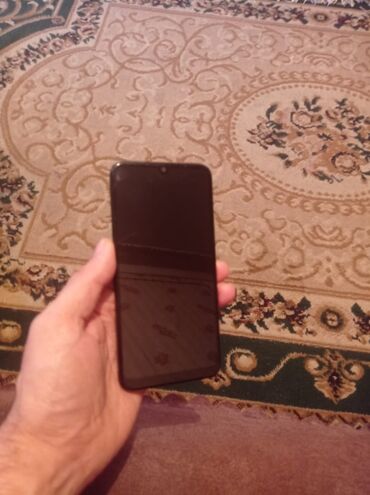 telefon nomre satisi: Xiaomi Redmi 7, 32 GB, rəng - Qara, 
 Barmaq izi
