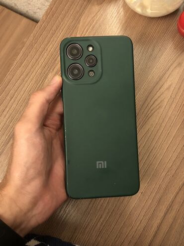 redmi 12 telefon: Xiaomi Redmi 12, 128 GB, rəng - Qara, 
 Simsiz şarj, Barmaq izi, Face ID