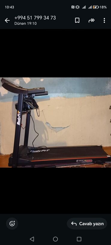 Qaçış trenajorları: BodyFit firmasının qara rəngdə qaçış trenajoru. Üzərində idman