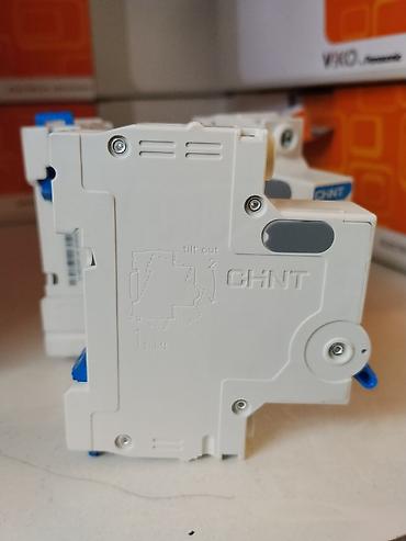 флажки: Автоматический выключатель CHiNT NXB-63, характеристика C, 25 A — 2
