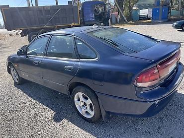 ом 422: Mazda Cronos: 1994 г., Седан — 6