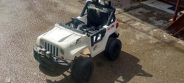 ugg bakü: Uşaq üçün elektrikli off-road maşın – 4x4 tipli, ağ rəng — 1