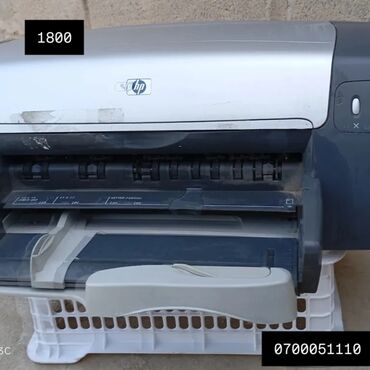 эпсон 1410 цена: Принтер HP серебристого и черного цвета. Имеет откидную переднюю