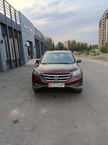 купить электробайк бу: Кроссовер Honda CR-V в темно-красном цвете, оснащенный литыми дисками