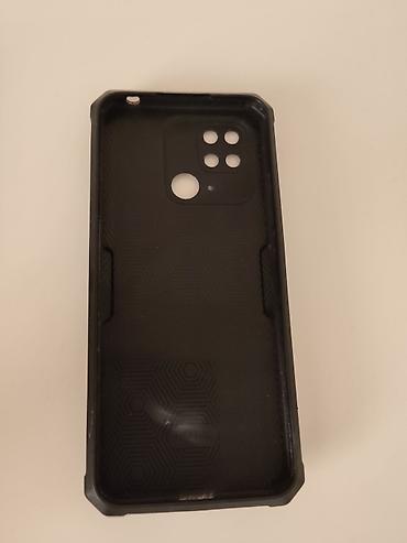 alcatel 9005x: Смартфон POCO (черный цвет). На задней панели — модуль основной камеры — 4