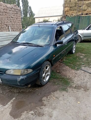 купить набор ключей force: Универсал Ford Mondeo темно-зеленого цвета, оснащенный рейлингами на