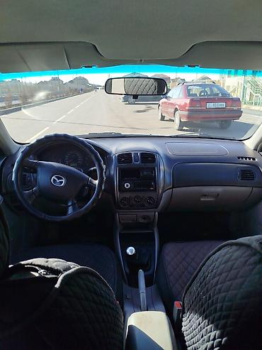 слиндир: Mazda Familia: 2002 г., Механика, Бензин, Хэтчбэк — 3