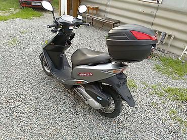 devo tiko: Скутер Honda (серия Dio) в серебристом цвете. Характеристики и — 1