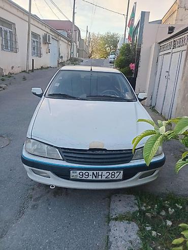 rezistor: Peugeot Pars sedan – ağ rəng, 4 qapı, öndən‑çəkişli. Xüsusiyyətlər: - — 3