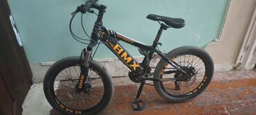 Городские велосипеды: BMX tipli idman velosipedi - Rəng: qara, narıncı loqotiplərlə (BMX