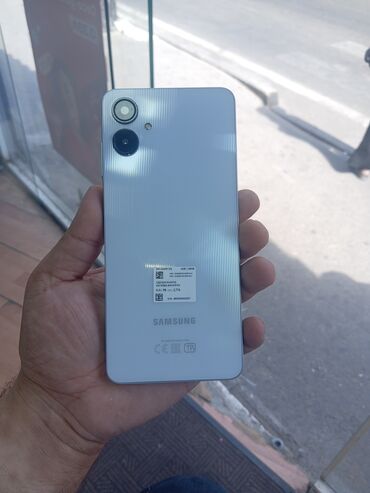 ptiminutka temiri: Samsung Galaxy A06, 128 GB, rəng - Ağ, Zəmanət, Düyməli, Sensor