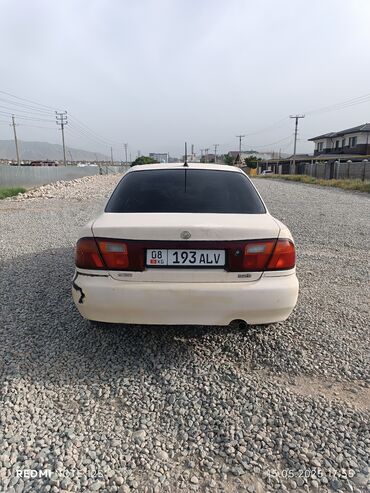 мазда 323 f: Mazda 323: 1996 г., 1.5 л, Механика, Бензин, Седан