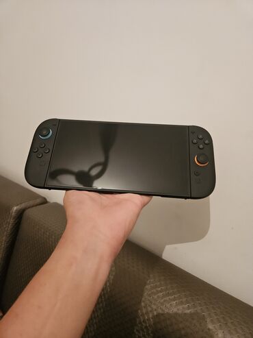 приставка свич: Портативная игровая консоль Nintendo Switch 2, выполненная в черном