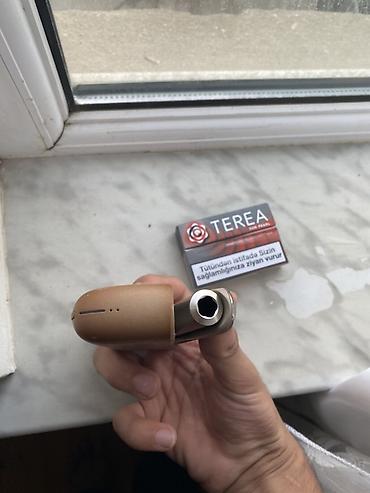 qizilar: IQOS Terea uyğun tütün qızdırma qurğusu Məhsulun tərkibi: - IQOS — 2