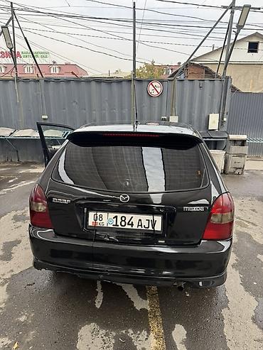 maxda demio: Mazda 323: 2001 г., Механика, Бензин, Хэтчбэк — 7