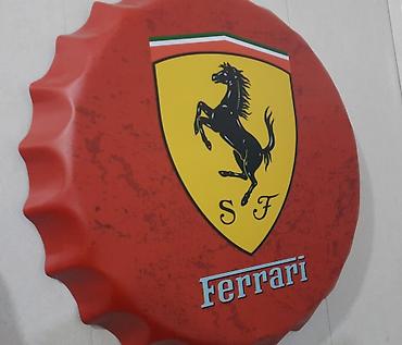 Ferrari: "Ferrari" yazılı, qapaq şəkilli metal lövhə. Yenidir. Diametri: 35sm — 1