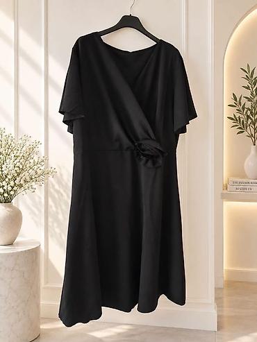 Haljine: Elegantna crna midi haljina

Haljina:3300dinara
Do 4xl — 2