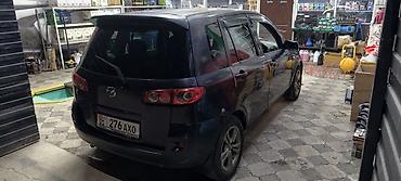 обмен на квартира: Mazda Demio: 2003 г., Автомат, Бензин — 4