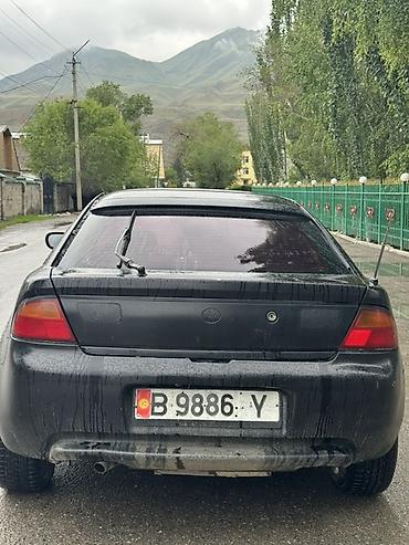 жентра цена: Mazda Lantis: 1999 г., Механика, Бензин, Седан — 3