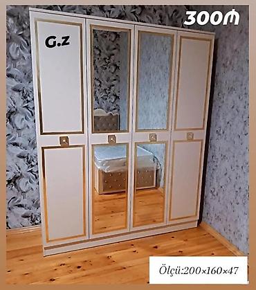 Ağ-qızılı çərçivəli 4 qapılı paltar dolabı. Orta hissədə 2 böyük güzgü lalafo.az -da Ağ-qızılı çərçivəli 4 qapılı paltar dolabı. Orta hissədə 2 böyük güzgü