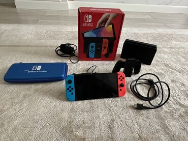 купить компьютерные игры на дисках: Игровая консоль Nintendo Switch в комплекте с док-станцией