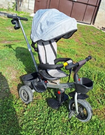 трехколесные прогулочные коляски: Детский трехколесный велосипед-коляска Prego с родительской ручкой -