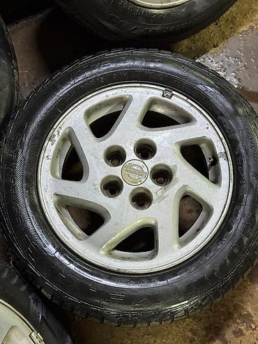d 4d: Комплект из 4 легкосплавных дисков Nissan с шинами. Характеристики: - — 2