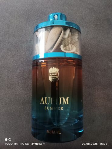 Ajmal Aurum Summer ətir suyu, mavi və qəhvəyi rəngli şüşə qabda təqdim
