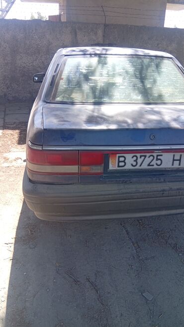 тюнинг мазда 323f слепая: Автомобиль Mazda 626 синего цвета, классический седан. Оснащен
