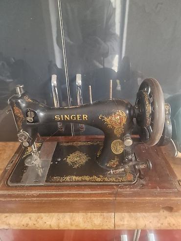 тыйын чычкан: Тигүүчү машина Singer, Механикалык — 1