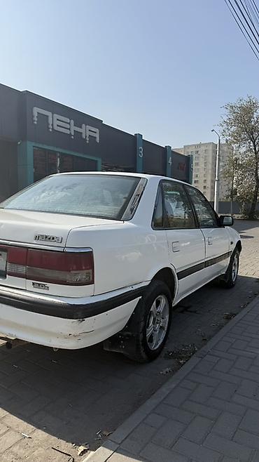 автомобильное зу: Mazda 626: 1990 г., 2 л, Механика, Бензин, Седан — 6
