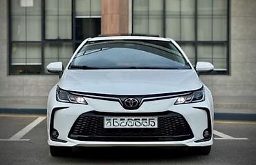 canqan avto: Toyota Corolla (sedan), ağ rəng İcarəyə verilir Depozit-400 AZN — 1