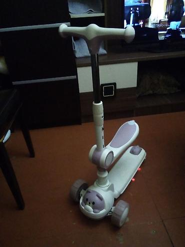 Mopedlər,skuterlər: Uşaq skuter–roller (3 təkərli) - Rəng: ağ-bənövşəyi tonlarda - Ön — 2