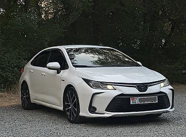 byd e6: Toyota Corolla: 2019 г., 1.8 л, Вариатор, Гибрид, Седан — 2