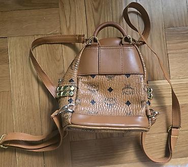 Modni rančevi: MCM mini stark ranac konjak braon boje sa monogram printom. Nov je — 11