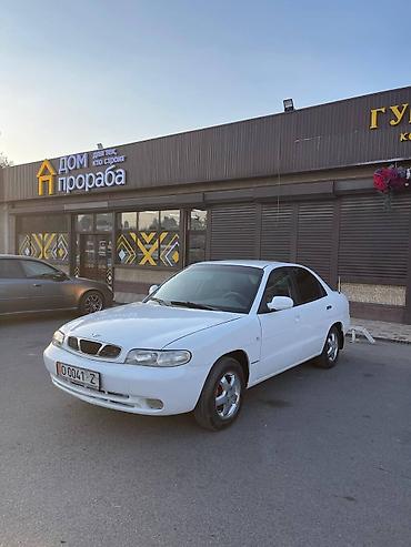 Транспорт: Daewoo Nubira: 1997 г., Бензин, Седан — 1