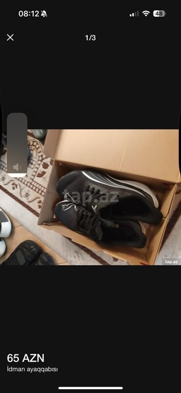 Ботинки: Puma brendinə məxsus qara rəngdə idman ayaqqabıları. Ağ detallarla