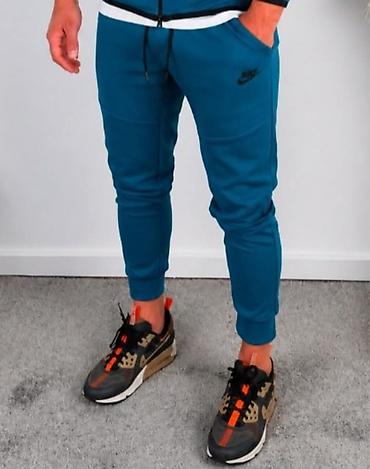 polo: Nike donji deo muške trenerke – plave,pamuk. - Model: uskog kroja sa — 1